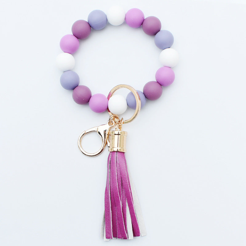 Llavero al por mayor de la muñeca de la borla de la PU del grano del silicón